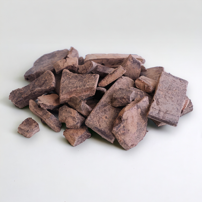 Organic Peruvian Cacao Paste Blocks: Stacked blocks of organic Peruvian cacao paste, showcasing their dark, rich color and smooth, dense texture, perfect for high-quality chocolate-making and culinary use.