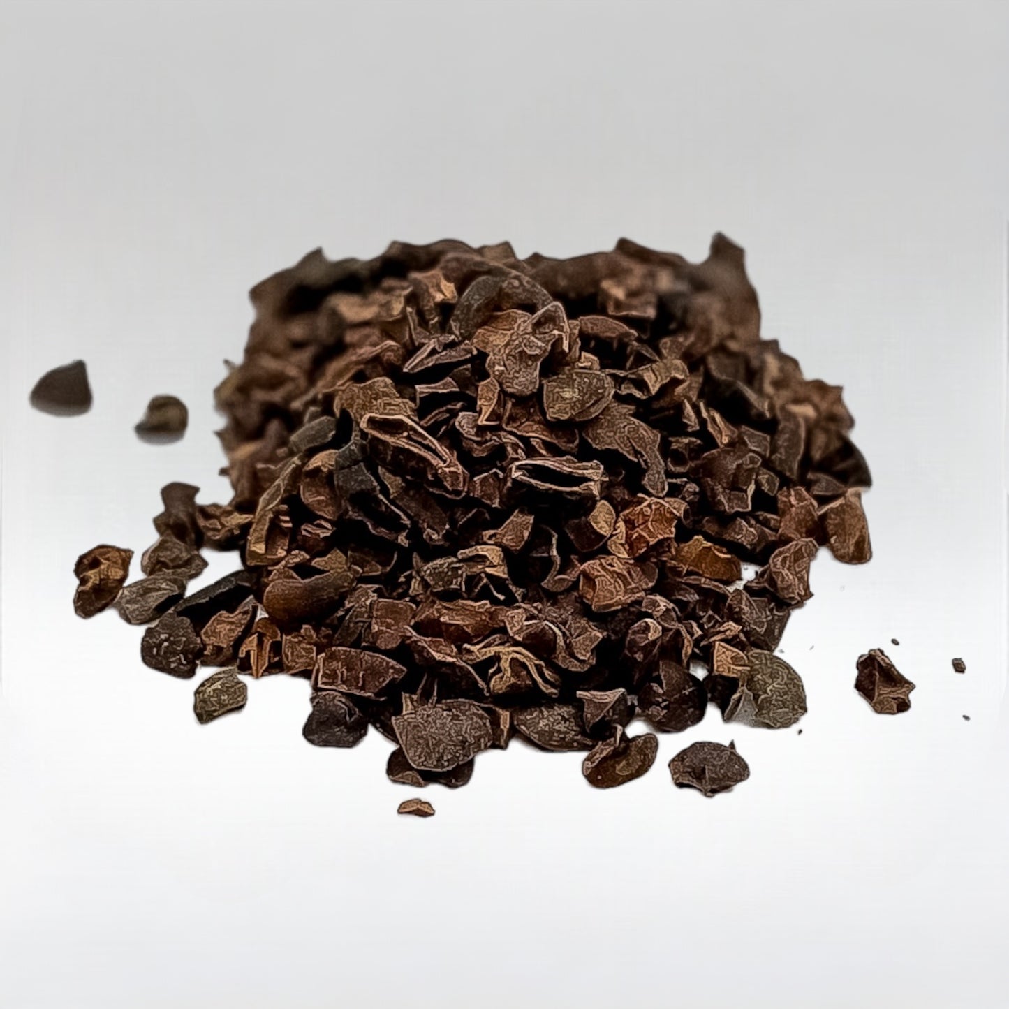 organic raw cacao nibs sweetened with yacon, highlighting the small, irregular pieces